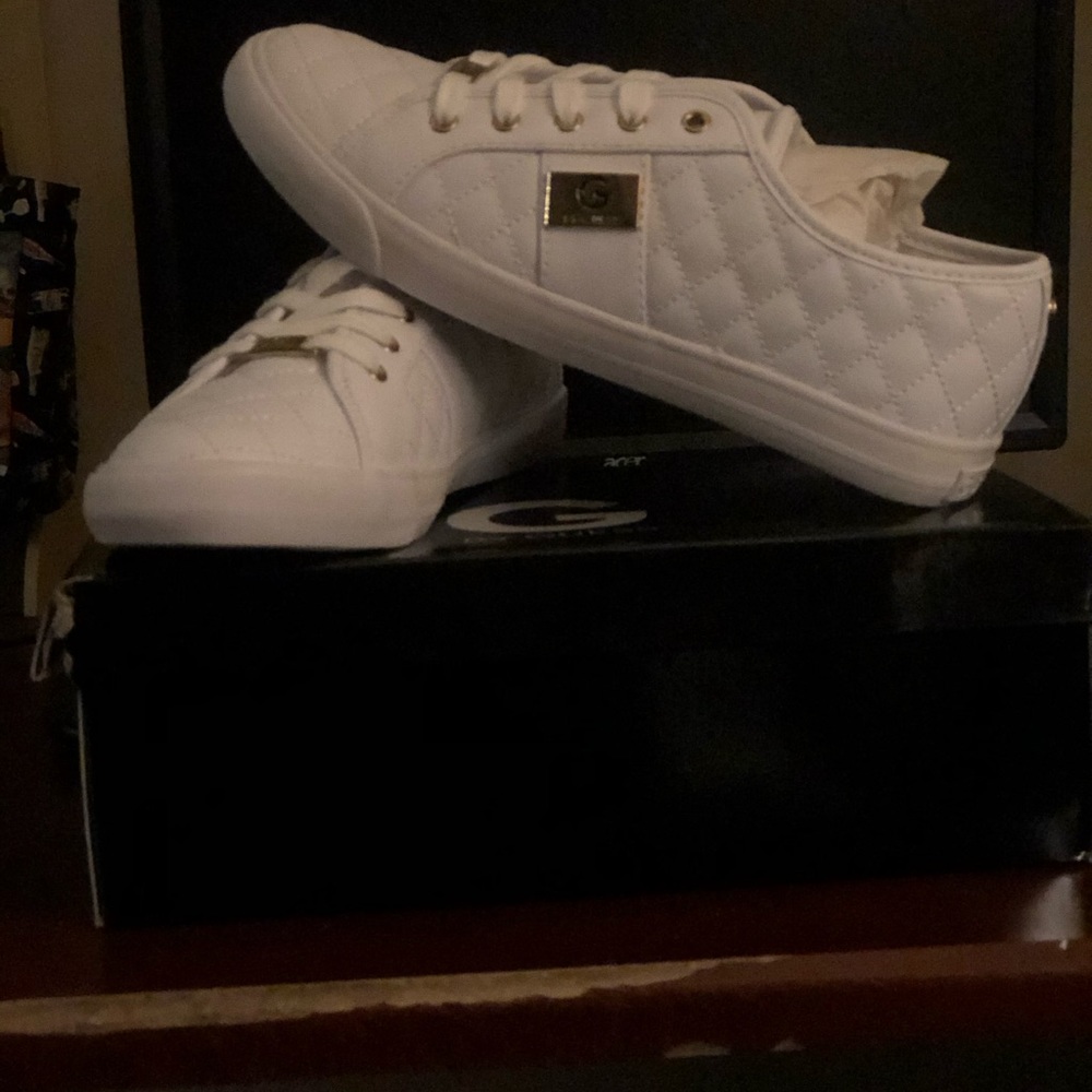 White with gold accents, leather like material.